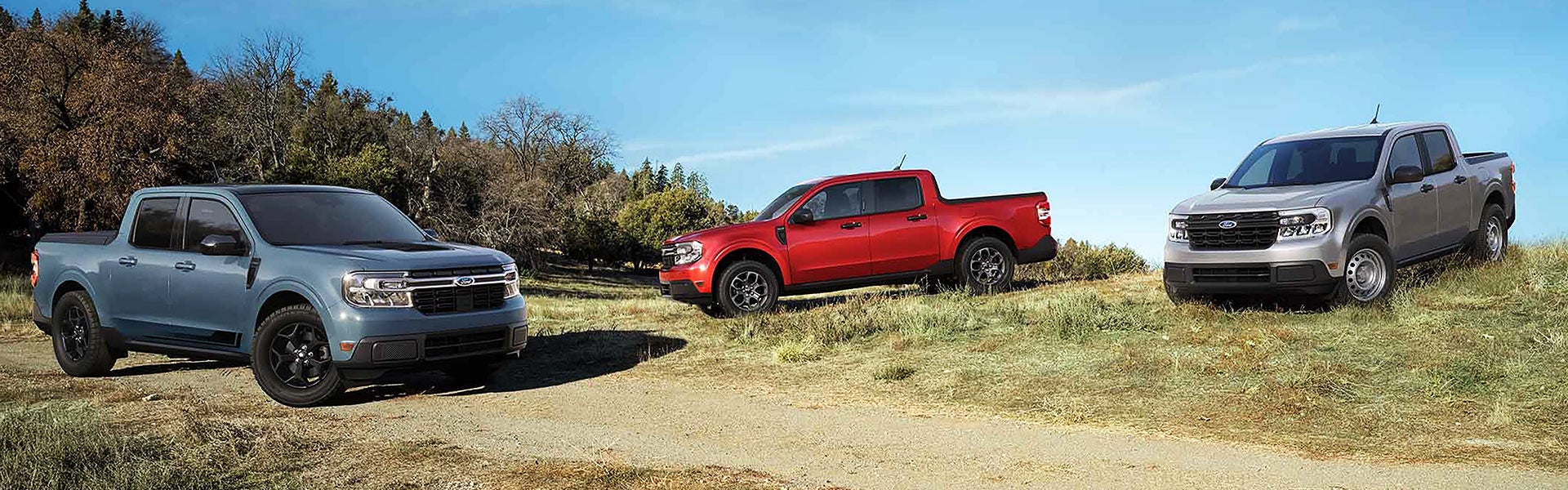Three Ford Maverick compact pickups parked on a grassy hillside, an affordable option for Roanoke, VA buyers